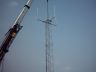 The mast going in
