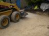 Spreading limestone chippings